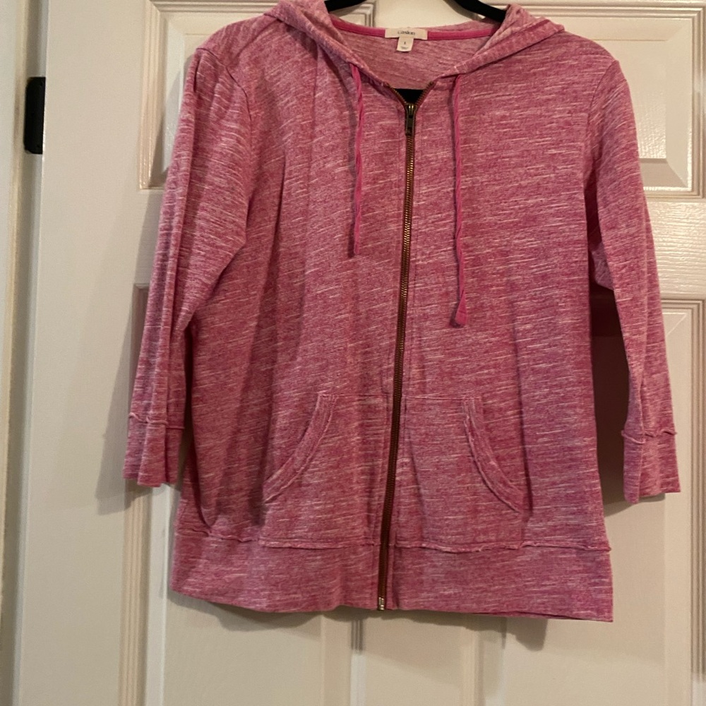 Pink three-quarter length zip up hoodie.